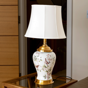 White lamp with gold accents and painted flowers and birds