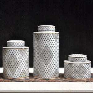 3 jar set diffrent sizes with matching lids, elegent mix of white and blabk mix with a hits of grey colors to elevate your home decor and the gold edges