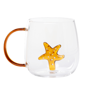 Glass cup with orange handle and 3D orange starfish inside